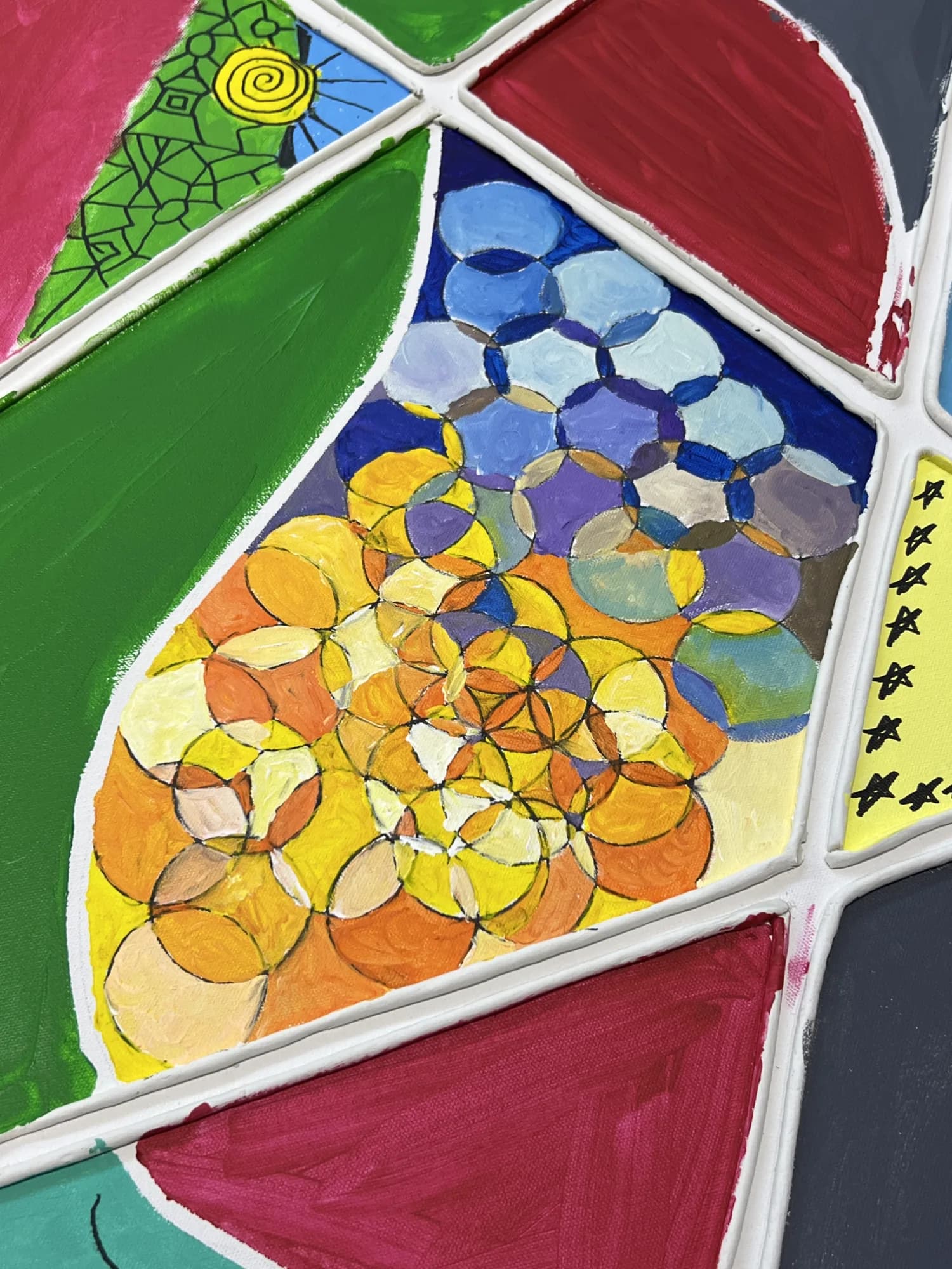Painted triangular panels across the shared canvas